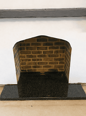 Simple decorative fireplace with granite hearth
