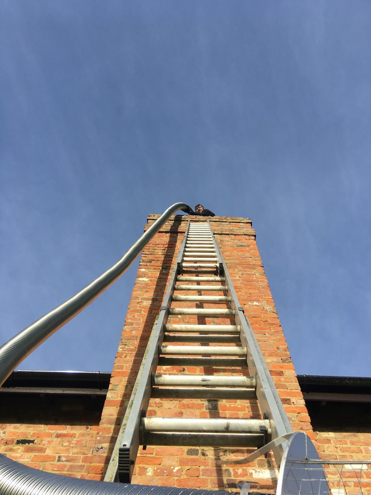 Fitting a liner into chimney