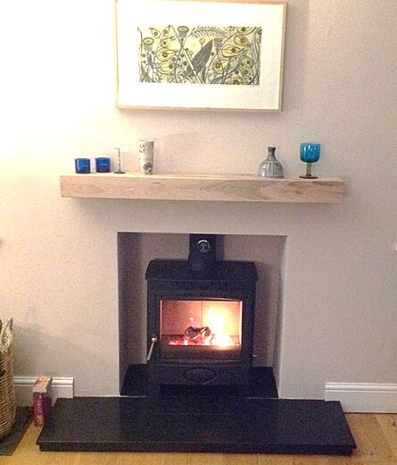 Multifuel Fuel Freestanding Stove with rendered chamber - granite hearth and oak beam shelf