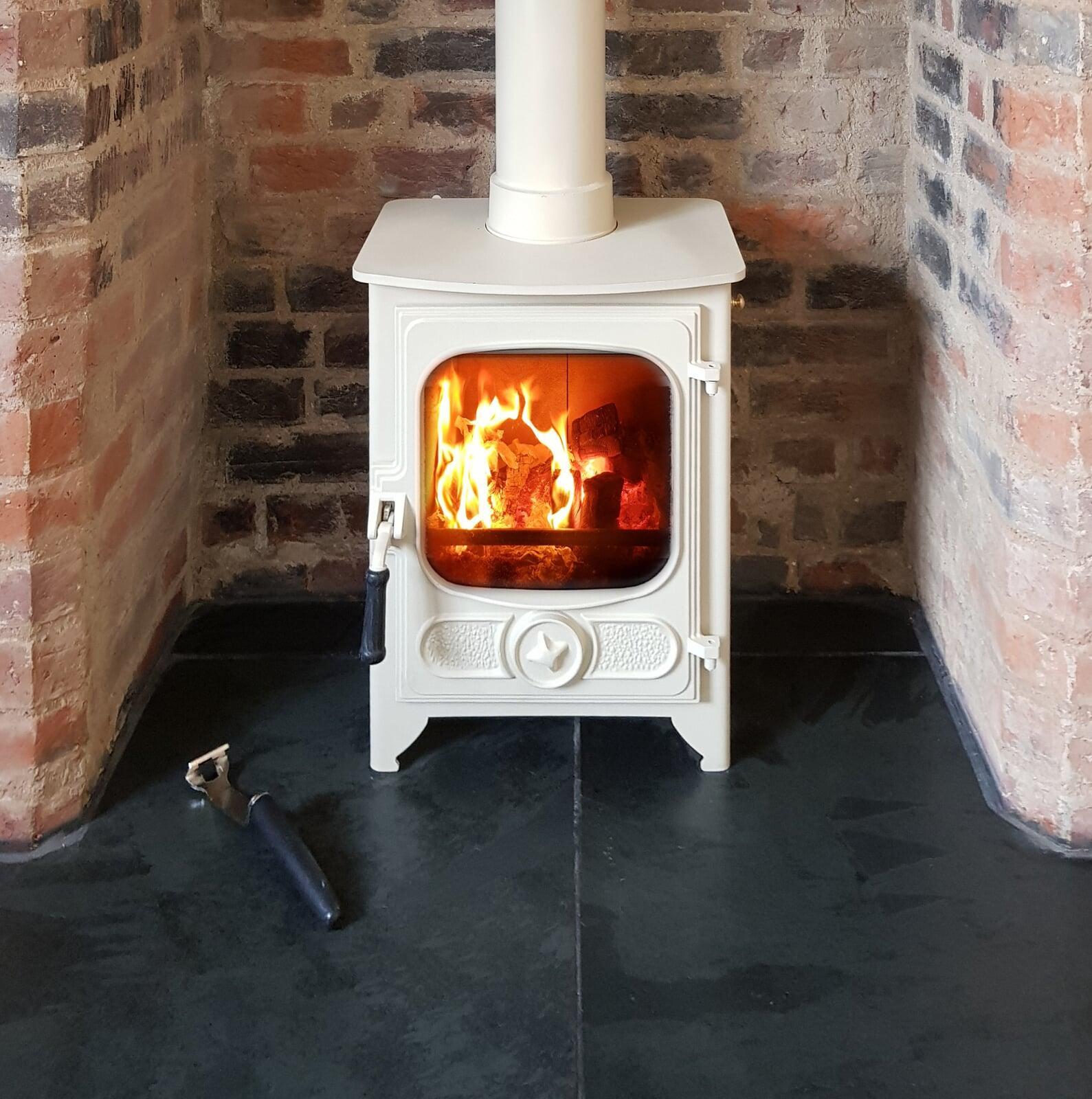 Woodburning stove with brick chamber and granite hearth