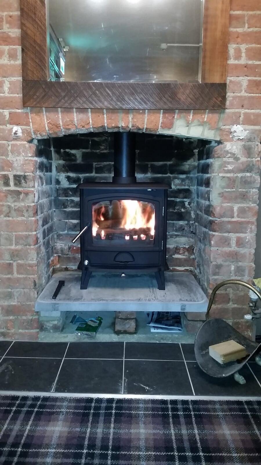 Multifuel Fuel Freestanding Stove with brick chamber and concrete plinth