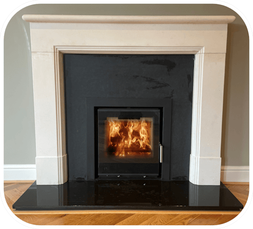 Cassette Style Stove with Granite Hearth Granite Slips and  Limestone Surround