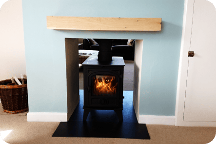 Double sided Wood Burning stove with rendered chamber and granite heath