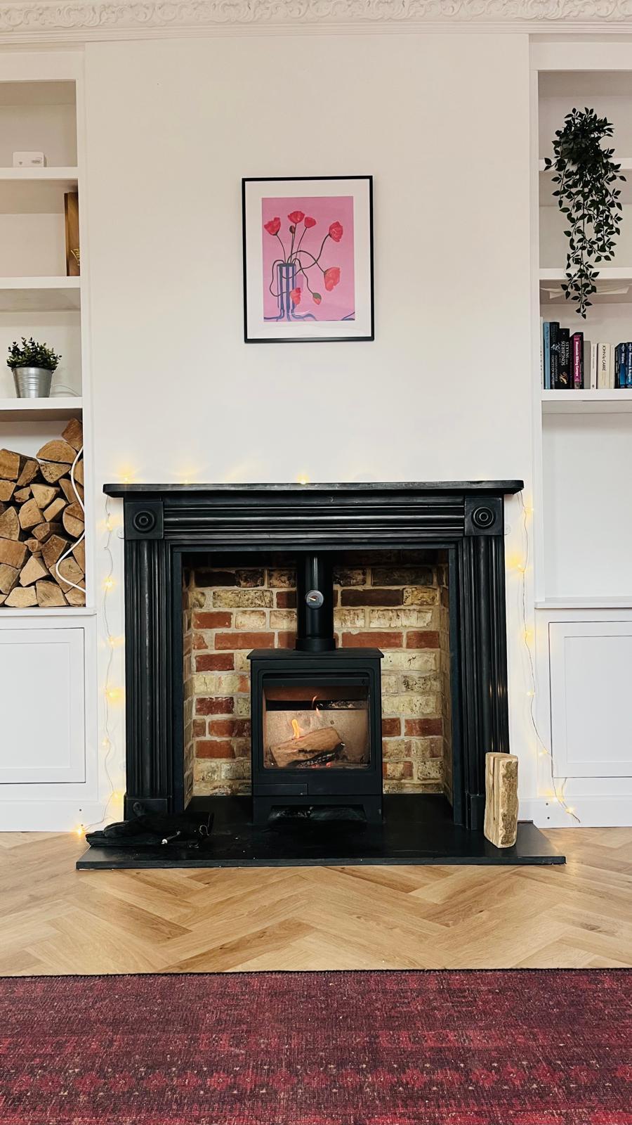 Wood burner with brick chamber and surround