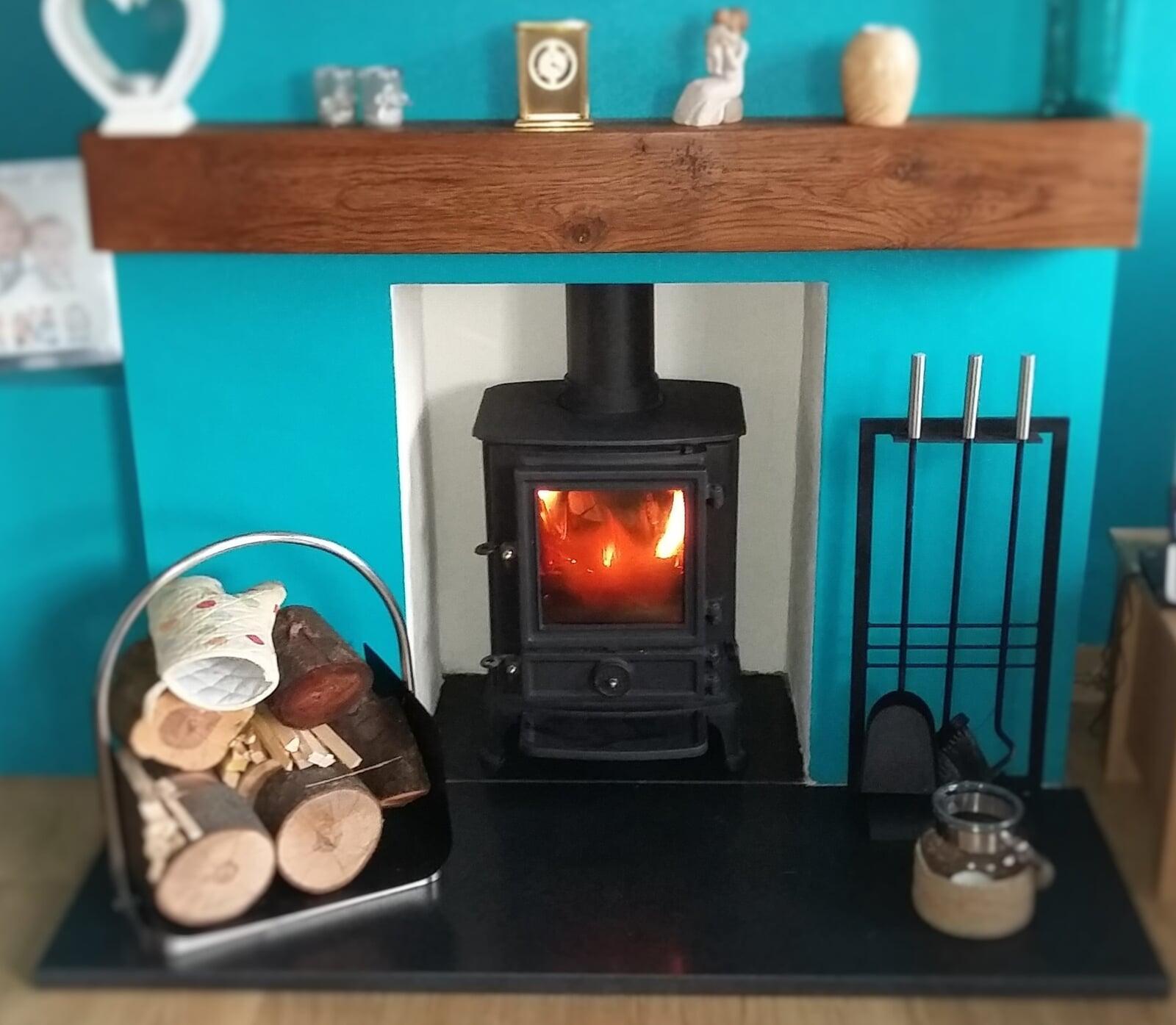 Multifuel Fuel Freestanding Stove with rendered chamber oak beam and granite hearth